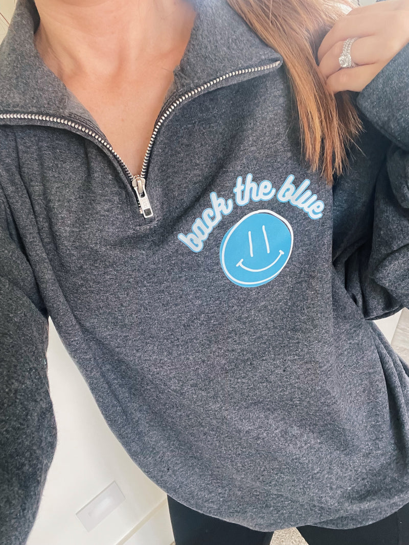 Back The Blue Happy Face © Pocket Print Unisex Quarter-Zip Sweatshirt (Black Heather)