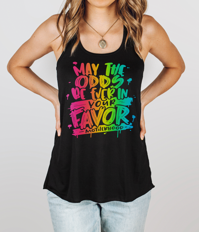 May The Odds Be Ever In Your Favor © Ladies Flowy Racerback Tank