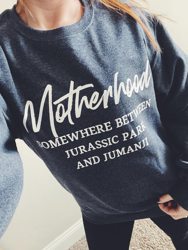 Somewhere Between Jurassic Park and Jumanji © Unisex Crewneck Sweatshirt (Navy Heather)