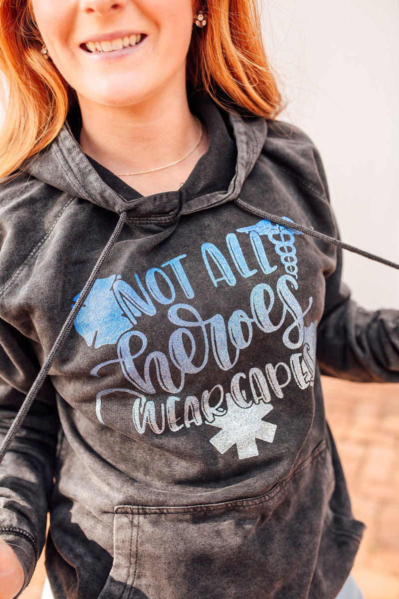 Not All Heroes Wear Capes © Mineral Wash Unisex Hoodie (Ombré Glitter)