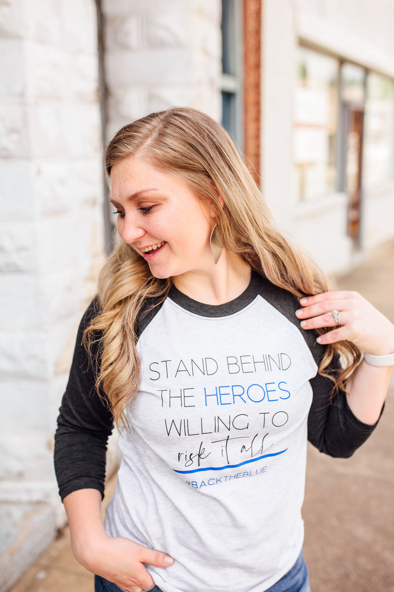 Stand Behind The Heroes Willing To Risk It All © Unisex Baseball Raglan (Black + Royal Blue)