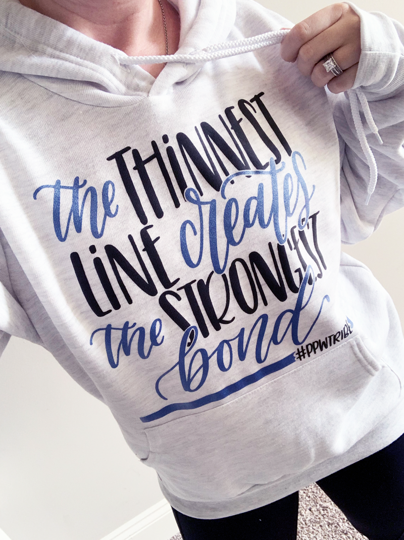 The Thinnest Line Creates The Strongest Bond © Unisex Pullover Hoodie (Black + Blue Shimmer)