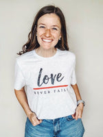 Love Never Fails © Unisex Top (Thin Red Line)